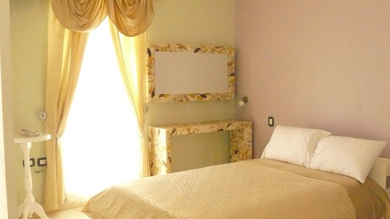 Hotel Cocoyotla โชลูลา ภายนอก รูปภาพ